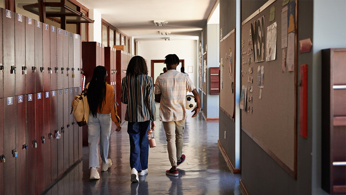 Kids walking in a school hallway